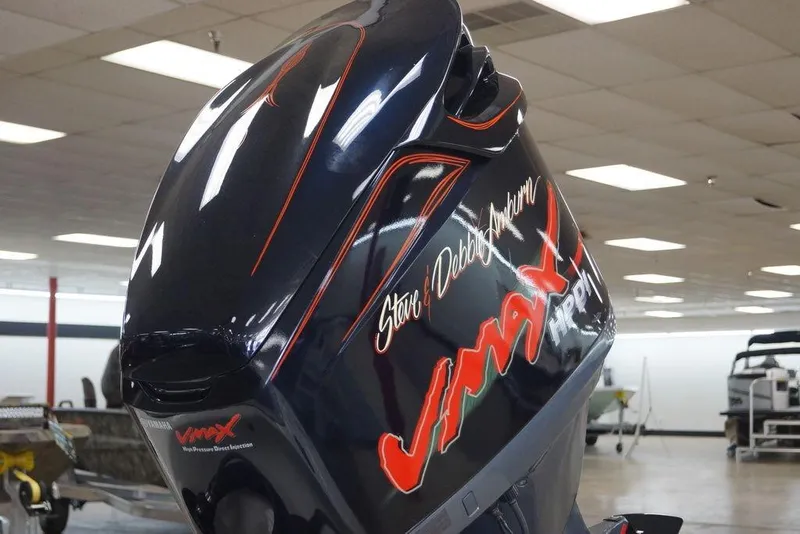 Slide: The Image of 2006 Ranger 521 VX boat engine with VMAX branding in a showroom setting. - 7