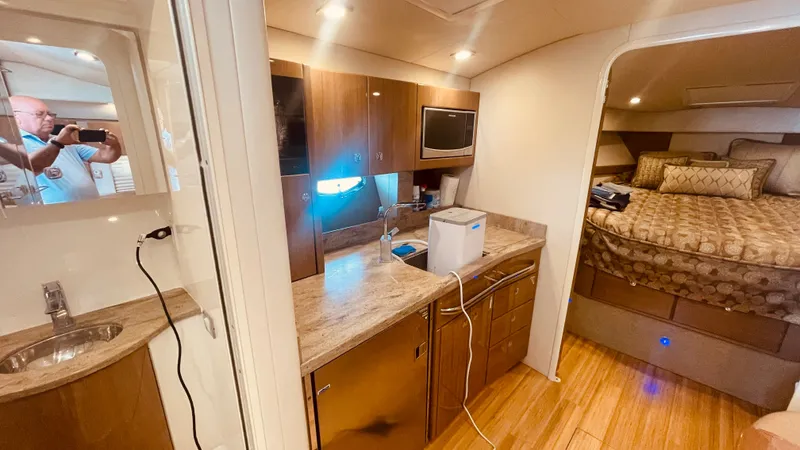 Slide: The Image of Interior of 2016 Formula 37 Performance Cruiser with kitchen and sleeping area. - 37
