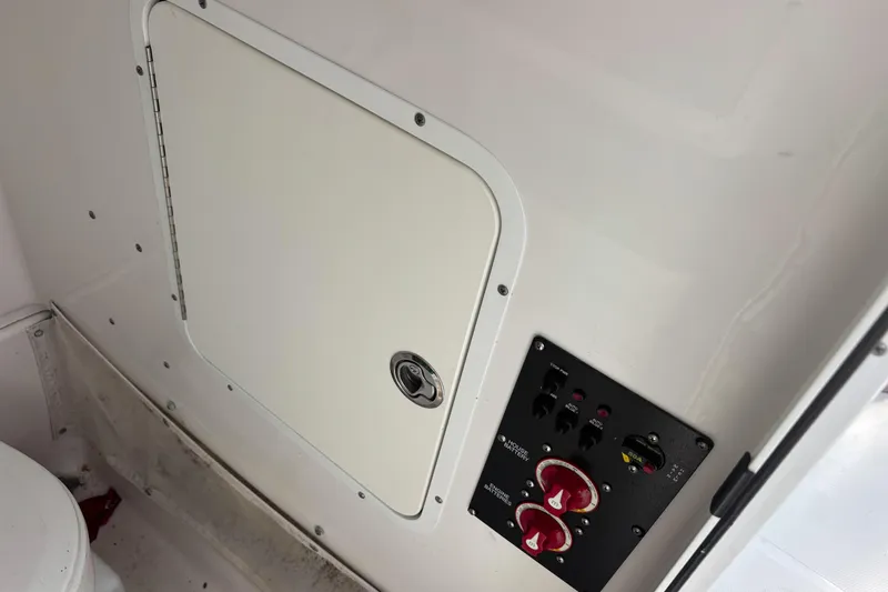 Slide: The Image of Control panel and storage compartment on 2018 Sea Hunt Gamefish 27 boat. - 12