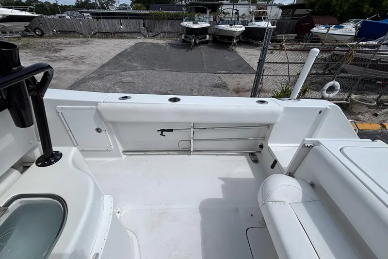 Slide: The Image of 2018 Sea Hunt Gamefish 27 boat interior with forward seating and storage compartments. - 18