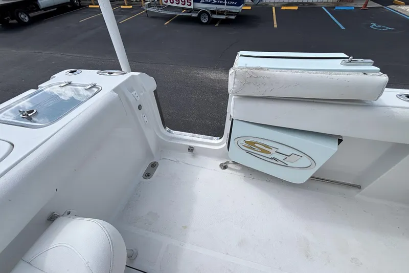 Slide: The Image of 2018 Sea Hunt Gamefish 27 boat interior with seating and storage compartments. - 20