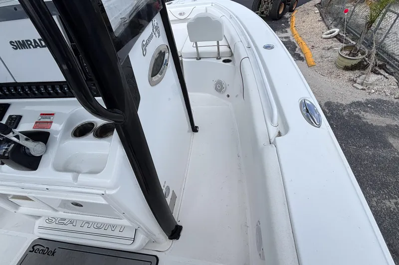 Slide: The Image of 2018 Sea Hunt Gamefish 27 boat interior with forward seating and control panel. - 29