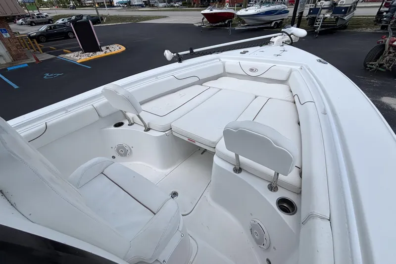 Slide: The Image of 2018 Sea Hunt Gamefish 27 Forward Seating boat with white cushioned seats and spacious deck. - 31