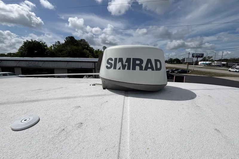 Slide: The Image of Simrad radar on 2018 Sea Hunt Gamefish 27 boat under cloudy sky. - 39