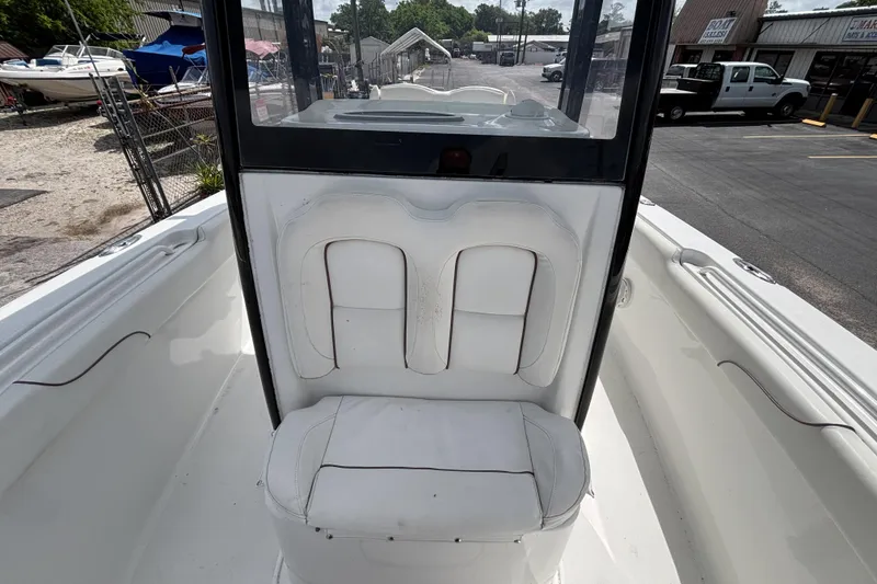 Slide: The Image of 2018 Sea Hunt Gamefish 27 Forward Seating boat interior with white cushioned seats. - 42