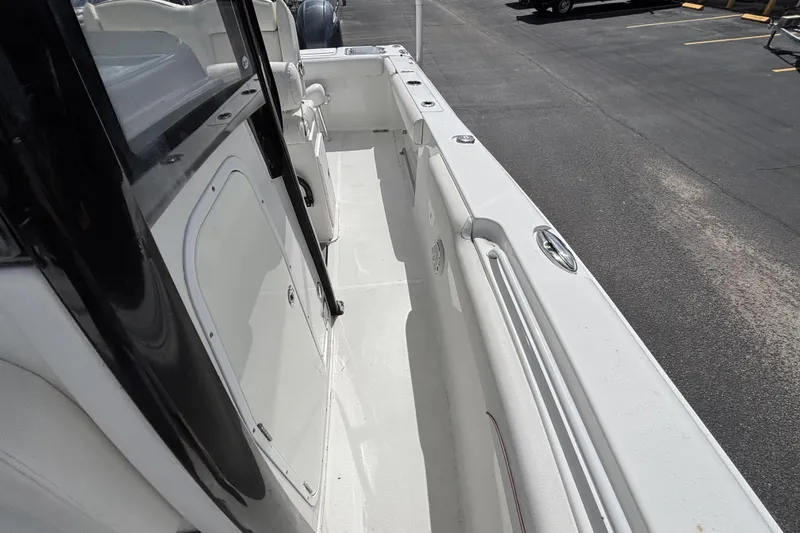 Slide: The Image of 2018 Sea Hunt Gamefish 27 Forward Seating boat interior, showcasing spacious deck and seating area. - 43