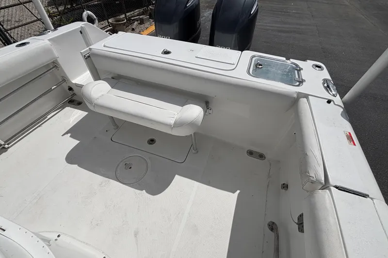 Slide: The Image of 2018 Sea Hunt Gamefish 27 boat interior with seating and storage compartments. - 47