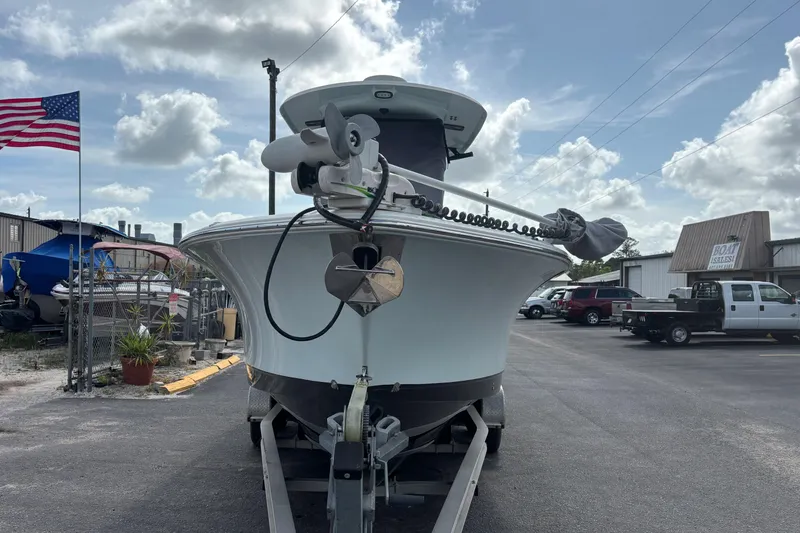 Slide: The Image of 2018 Sea Hunt Gamefish 27 boat on trailer, American flag, dealership background. - 8