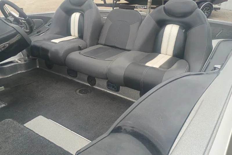 Slide: The Image of Interior of a 2010 Ranger Z520 boat with black and white seating. - 10