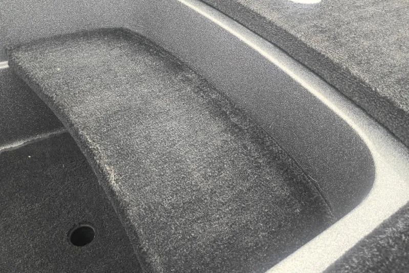 Slide: The Image of Carpeted interior of a 2010 Ranger Z520 boat compartment. - 11