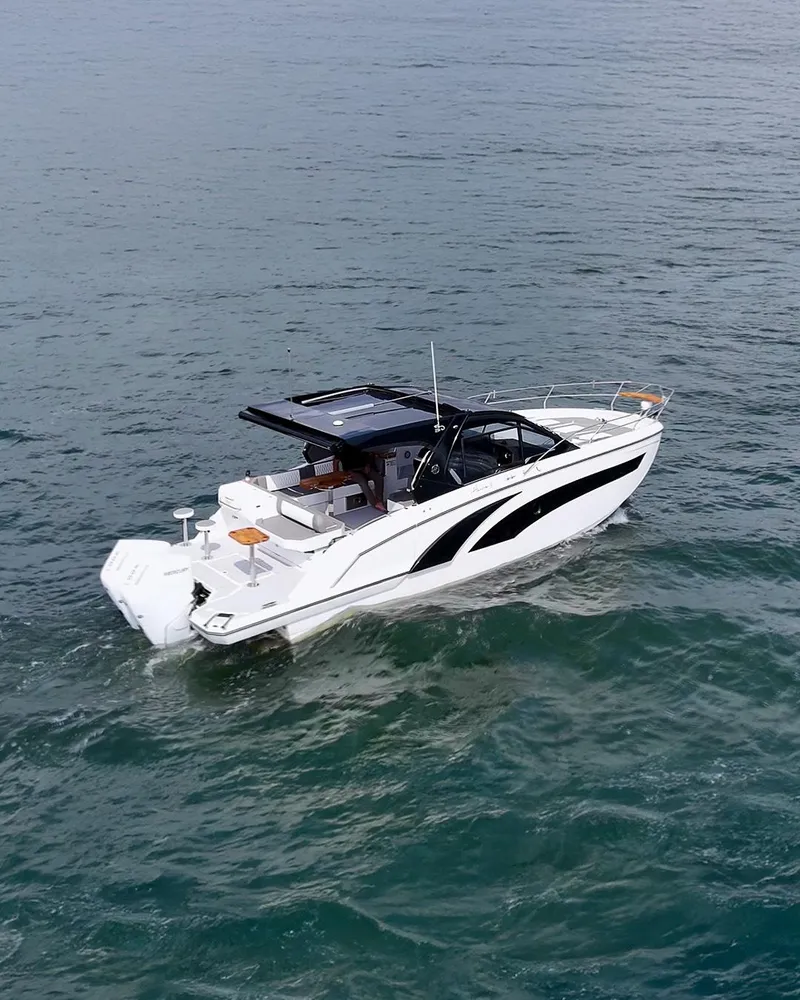 Slide: The Image of 2025 Hanover 387 boat cruising on open water, showcasing sleek design and modern features. - 14