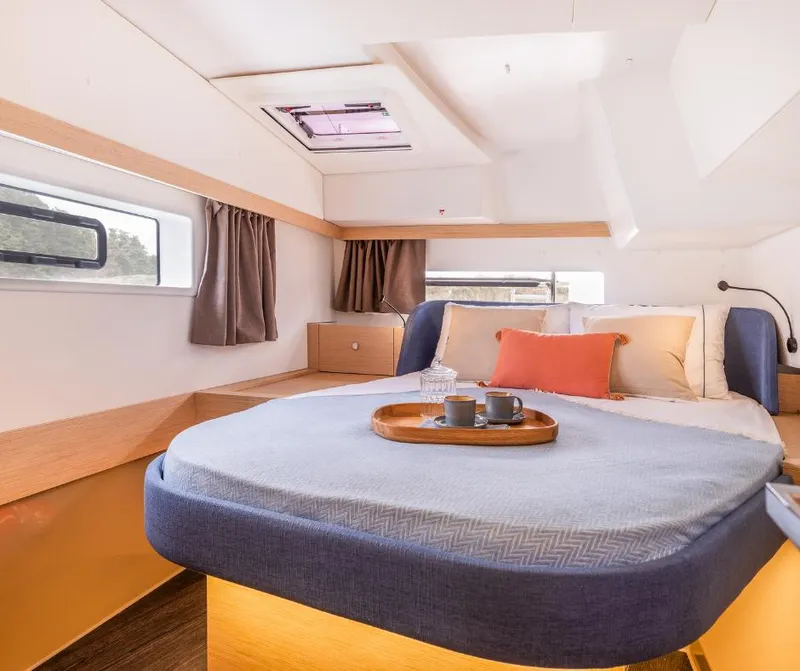 Slide: The Image of Luxurious cabin interior of 2025 Fountaine Pajot NEW 41 catamaran, featuring cozy bedding and modern design. - 23