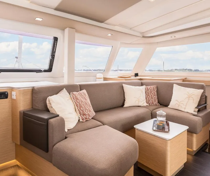 Slide: The Image of Luxurious interior of 2025 Fountaine Pajot NEW 41 catamaran with plush seating and panoramic windows. - 6