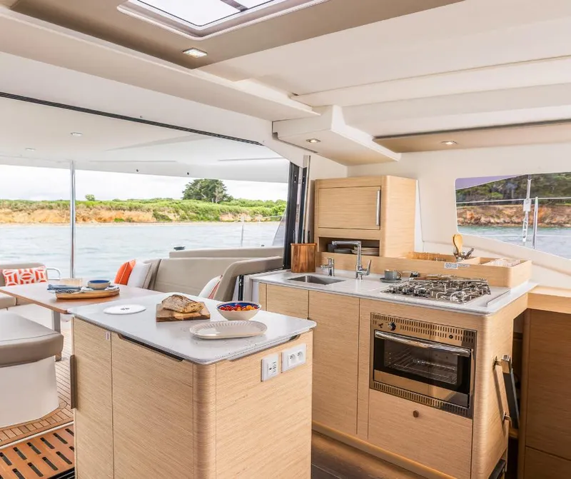 Slide: The Image of Modern kitchen interior of 2025 Fountaine Pajot NEW 41 yacht, featuring sleek design and appliances. - 7