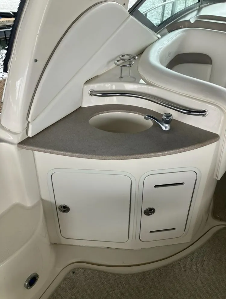 Slide: The Image of Interior of 2004 Sea Ray Sundancer 320 with sink and storage. - 10