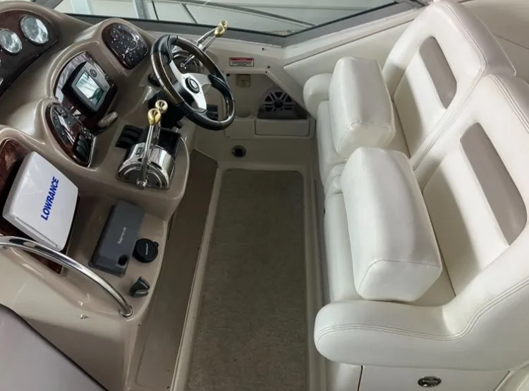 Slide: The Image of Interior of 2004 Sea Ray Sundancer 320 with helm console. - 13