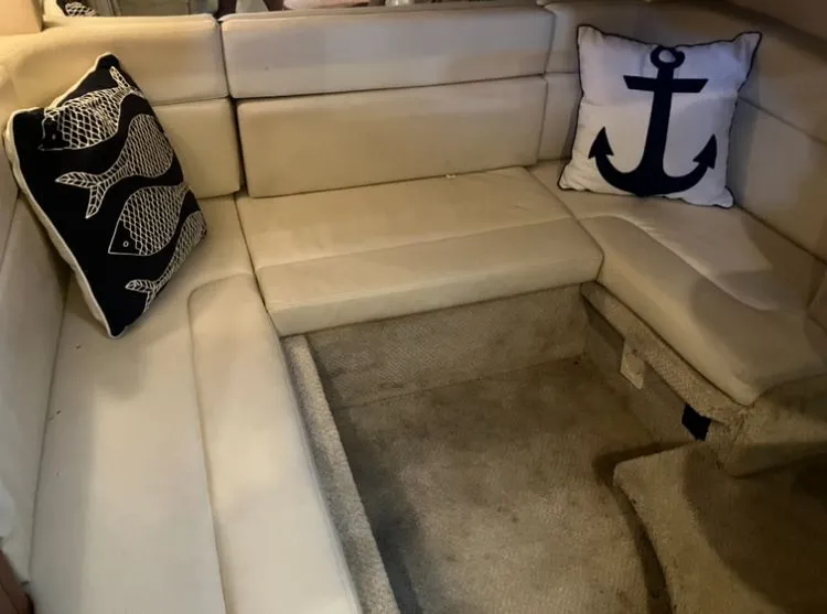 Slide: The Image of Interior of a Sea Ray Sundancer 320 yacht with decorative pillows. - 29