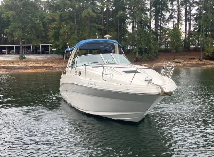 Slide: The Image of 2004 Sea Ray Sundancer 320 anchored on calm water. - 3