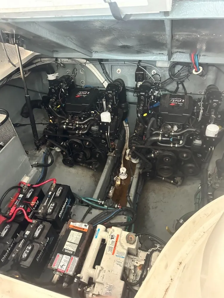 Slide: The Image of Engine room of a 2004 Sea Ray Sundancer 320 with dual engines. - 36