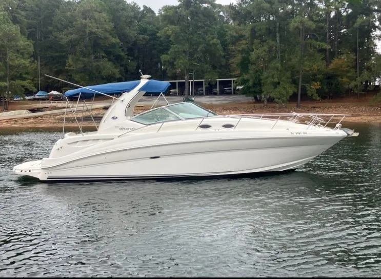 Slide: The Image of 2004 Sea Ray Sundancer 320 anchored on calm water. - 4