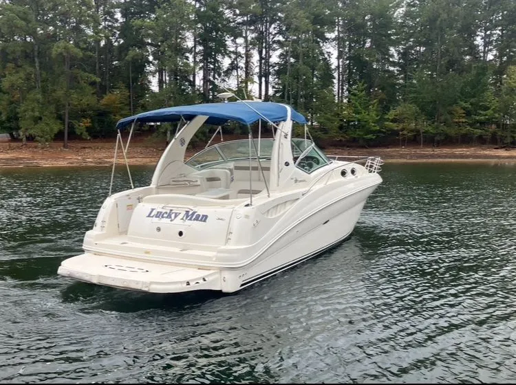 Slide: The Image of 2004 Sea Ray Sundancer 320 boat on a tranquil lake. - 5