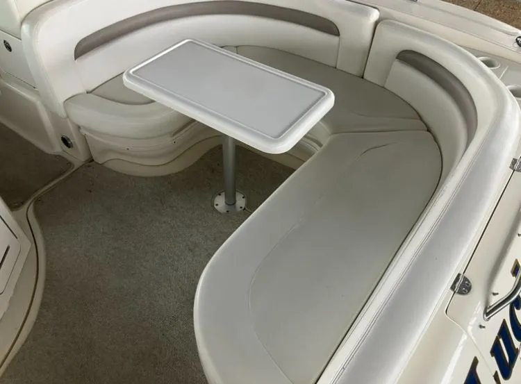 Slide: The Image of Interior of 2004 Sea Ray Sundancer 320 with seating and table. - 9