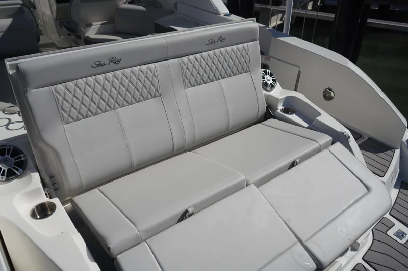 Slide: The Image of 2023 Sea Ray SLX 350 boat with luxurious seating and modern design. - 12
