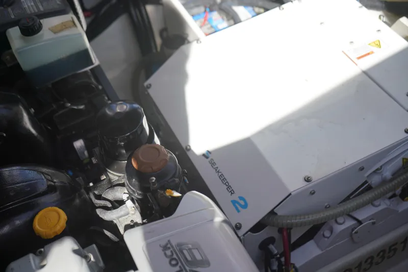 Slide: The Image of Engine compartment of 2023 Sea Ray SLX 350 with Seakeeper 2 stabilization system. - 16