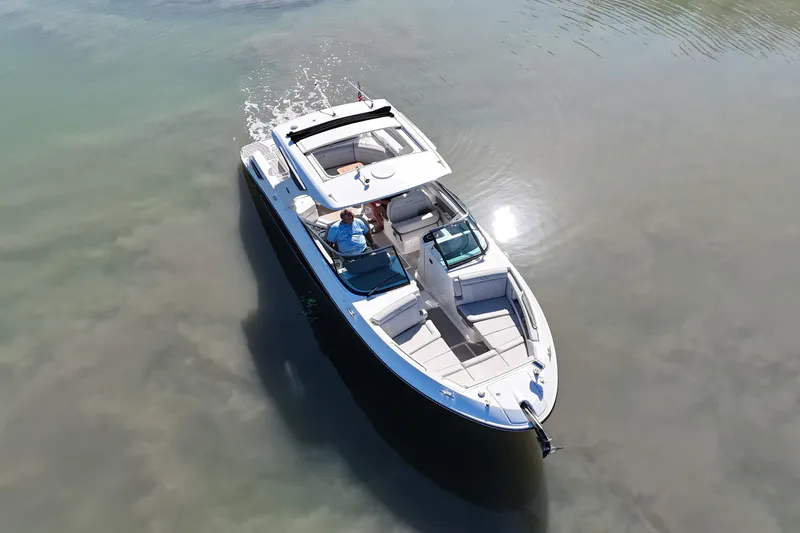 Slide: The Image of 2023 Sea Ray SLX 350 luxury boat cruising on calm waters, aerial view. - 3