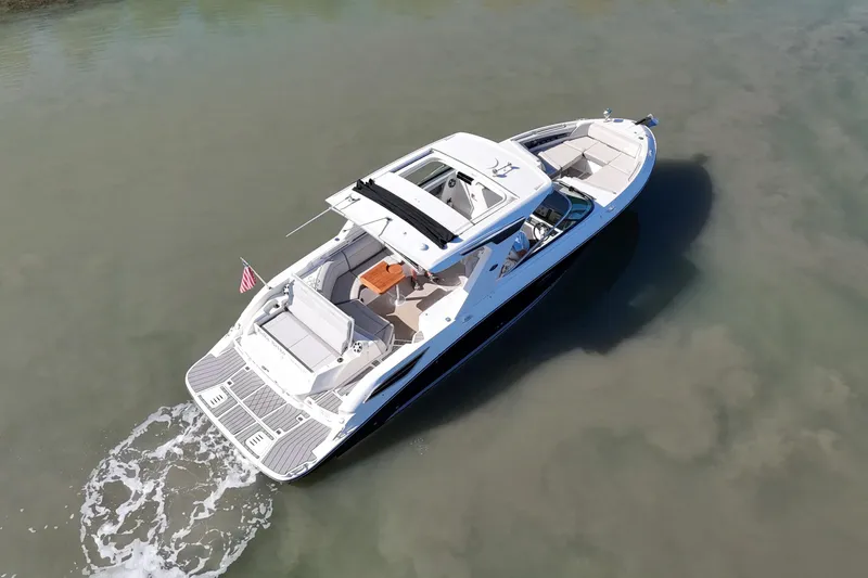 Slide: The Image of 2023 Sea Ray SLX 350 luxury boat cruising on calm waters, aerial view. - 4