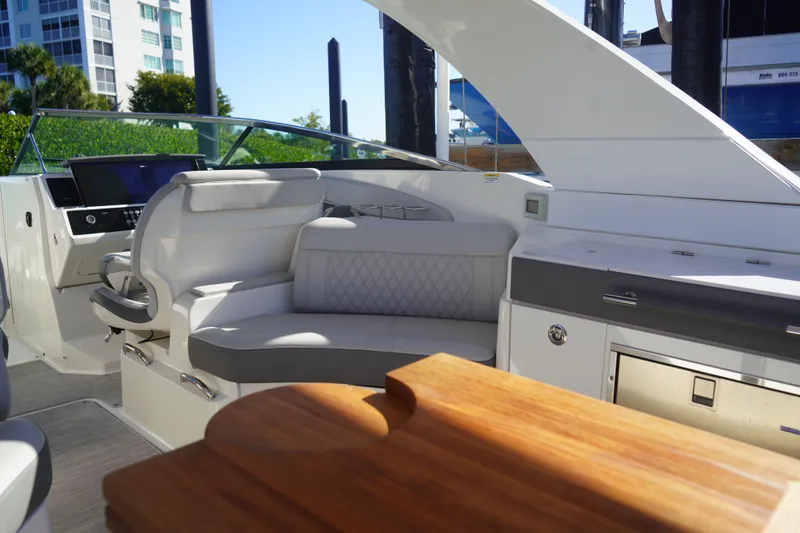 Slide: The Image of Luxurious interior of 2023 Sea Ray SLX 350 boat with plush seating and modern dashboard. - 8