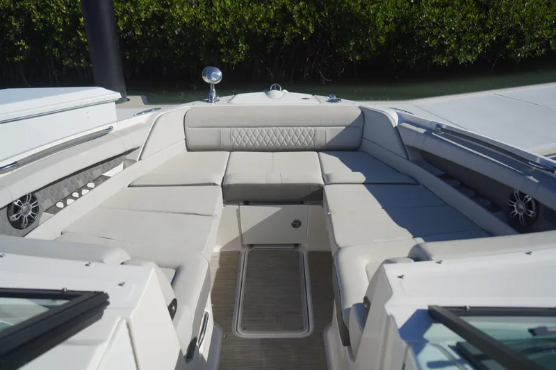 Slide: The Image of Luxurious seating area on 2023 Sea Ray SLX 350 boat, featuring elegant upholstery and spacious design. - 9