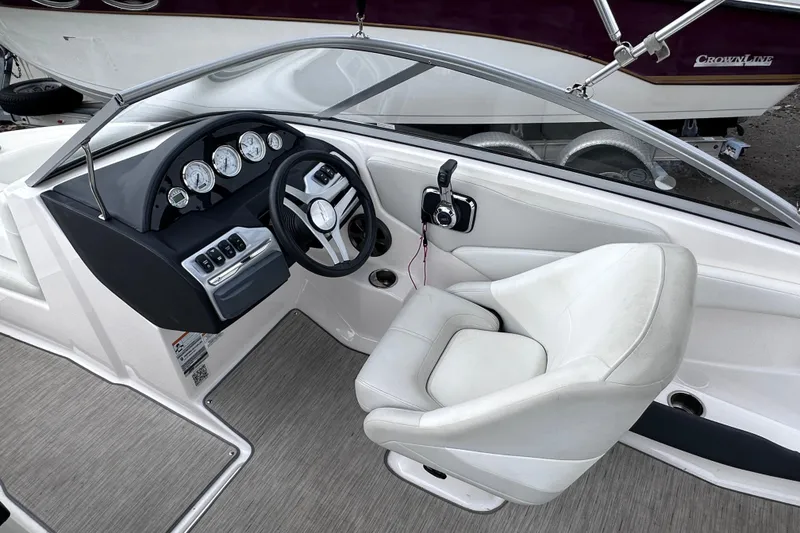 Slide: The Image of 2018 Regal 1900 ES Bowrider cockpit with steering wheel and gauges. - 14