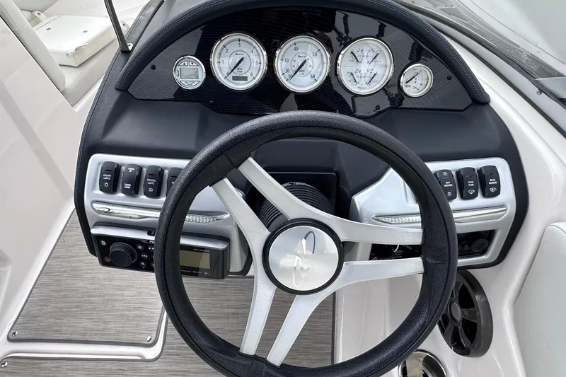 Slide: The Image of Steering wheel and dashboard of 2018 Regal 1900 ES Bowrider boat. - 15