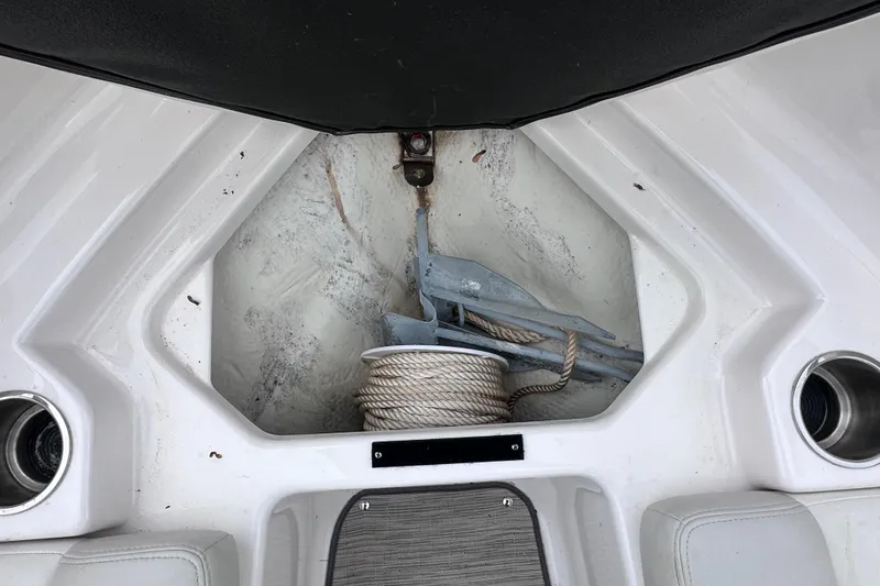 Slide: The Image of 2018 Regal 1900 ES Bowrider anchor storage with rope and anchor visible. - 22