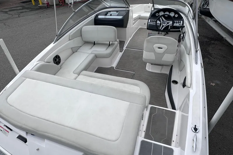 Slide: The Image of 2018 Regal 1900 ES Bowrider interior with seating and steering wheel. - 7