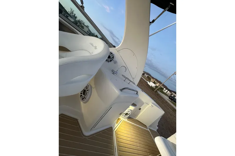 Slide: The Image of 2007 Sea Ray Sundancer 280 boat interior with seating and sink, featuring elegant design. - 19