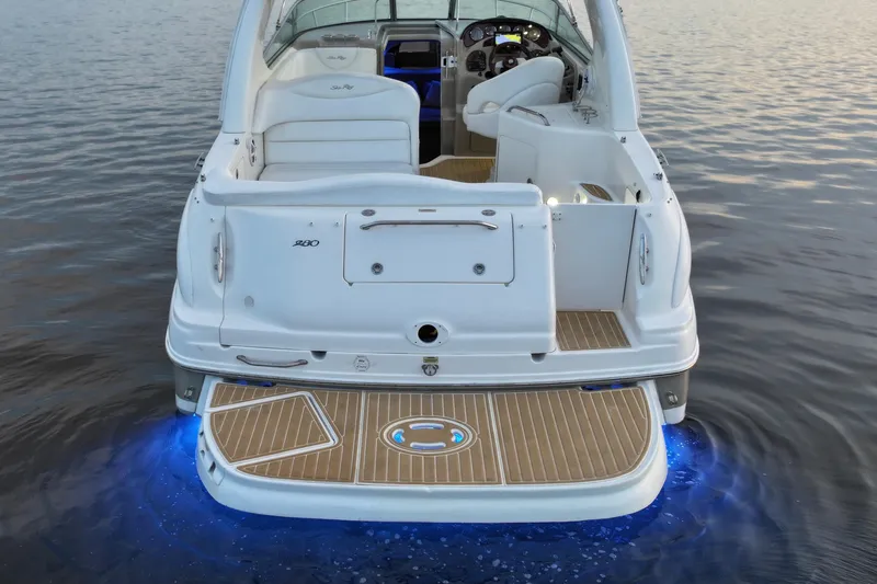 Slide: The Image of 2007 Sea Ray Sundancer 280 boat with illuminated deck on calm water. - 6