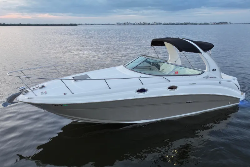 Slide: The Image of 2007 Sea Ray Sundancer 280 boat on calm water at sunset. - 9