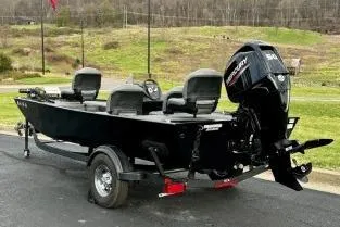 Slide: The Image of 2024 Tracker Bass Tracker Classic XL boat with Mercury engine on trailer. - 8
