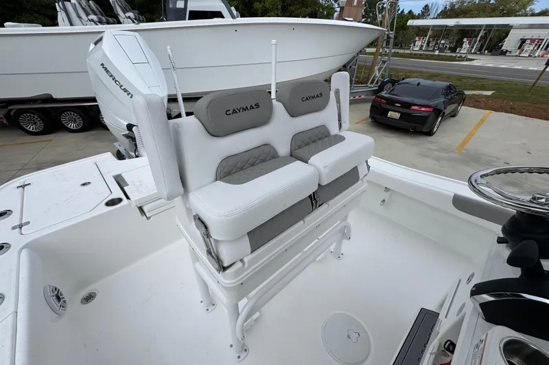 Slide: The Image of 2026 Caymas 26 HB boat interior with dual seats and Mercury engine. - 30