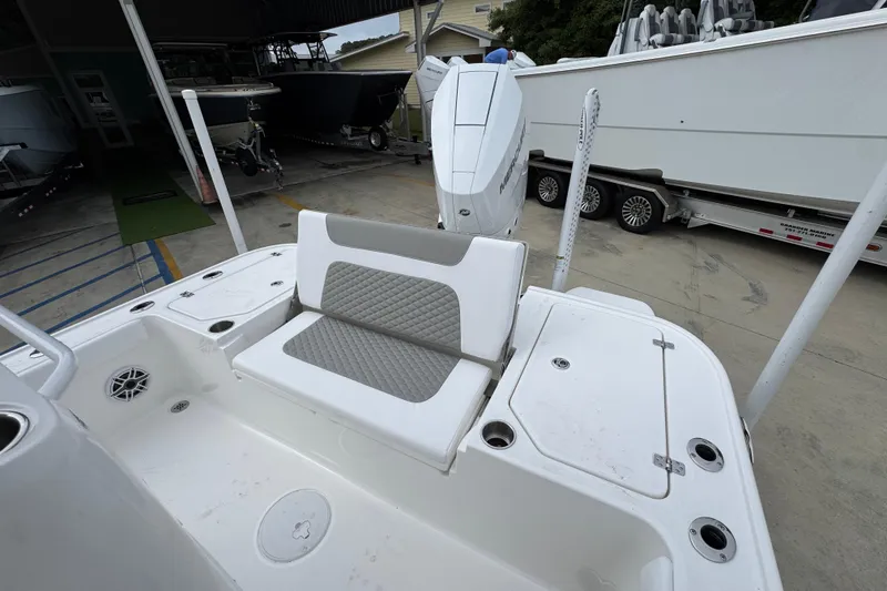 Slide: The Image of 2026 Caymas 26 HB boat interior with seating and storage compartments. - 37