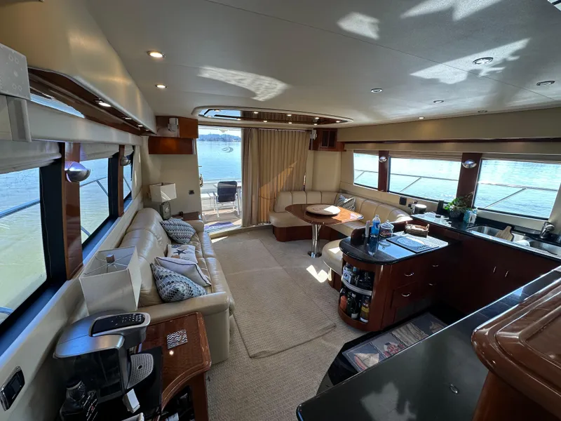 Slide: The Image of Luxurious interior of a 2005 Carver 56 Voyager yacht with elegant furnishings and panoramic windows. - 12