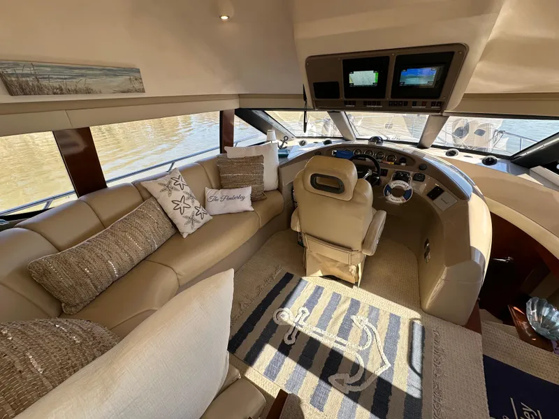 Slide: The Image of Luxurious interior of 2005 Carver 56 Voyager yacht with plush seating and modern dashboard. - 15