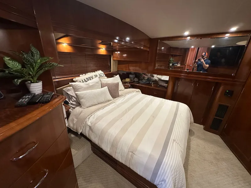 Slide: The Image of Luxurious bedroom interior of 2005 Carver 56 Voyager yacht with elegant wood finishes. - 18