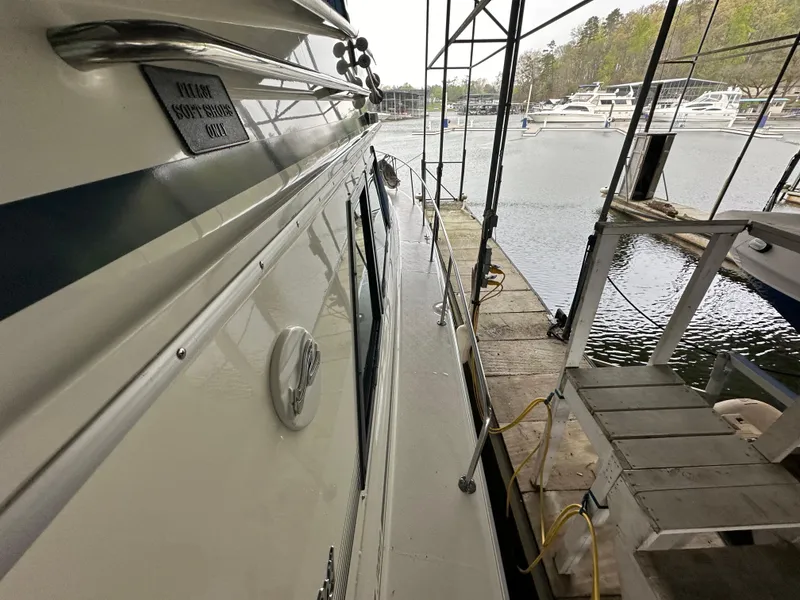 Slide: The Image of 1991 Sea Ray 380 Aft Cabin docked at a marina. - 16