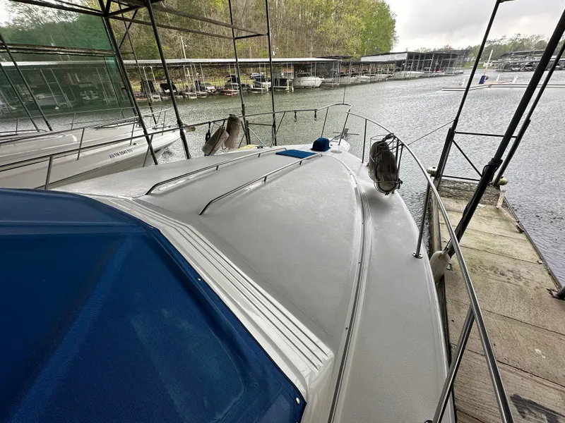 Slide: The Image of 1991 Sea Ray 380 Aft Cabin docked at a marina. - 17