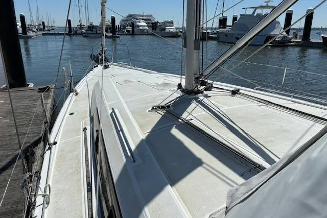 Slide: The Image of 2017 Beneteau Oceanis 41.1 sailboat docked at marina, showcasing deck and rigging. - 11