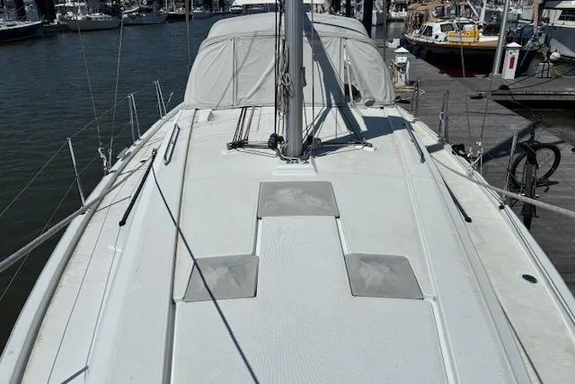 Slide: The Image of 2017 Beneteau Oceanis 41.1 sailboat docked at marina, view of deck and mast. - 13