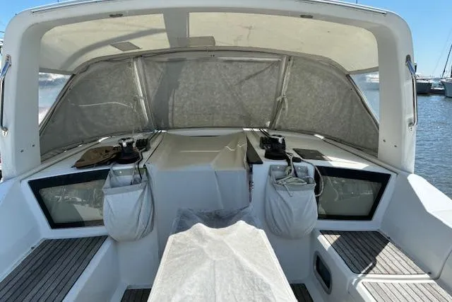 Slide: The Image of Cockpit of 2017 Beneteau Oceanis 41.1 sailboat with covered seating and winches. - 17